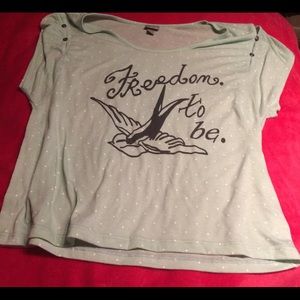 Blue polka-dotted shirt.